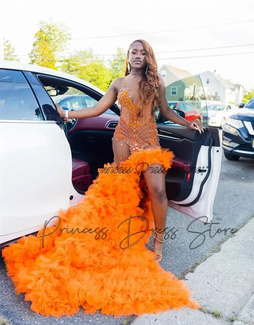 Load image into Gallery viewer, Fiery Glamour: Sparkly Orange Mermaid Gown with High Slit and Ruffles
