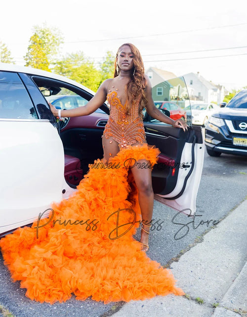 Load image into Gallery viewer, Fiery Glamour: Sparkly Orange Mermaid Gown with High Slit and Ruffles
