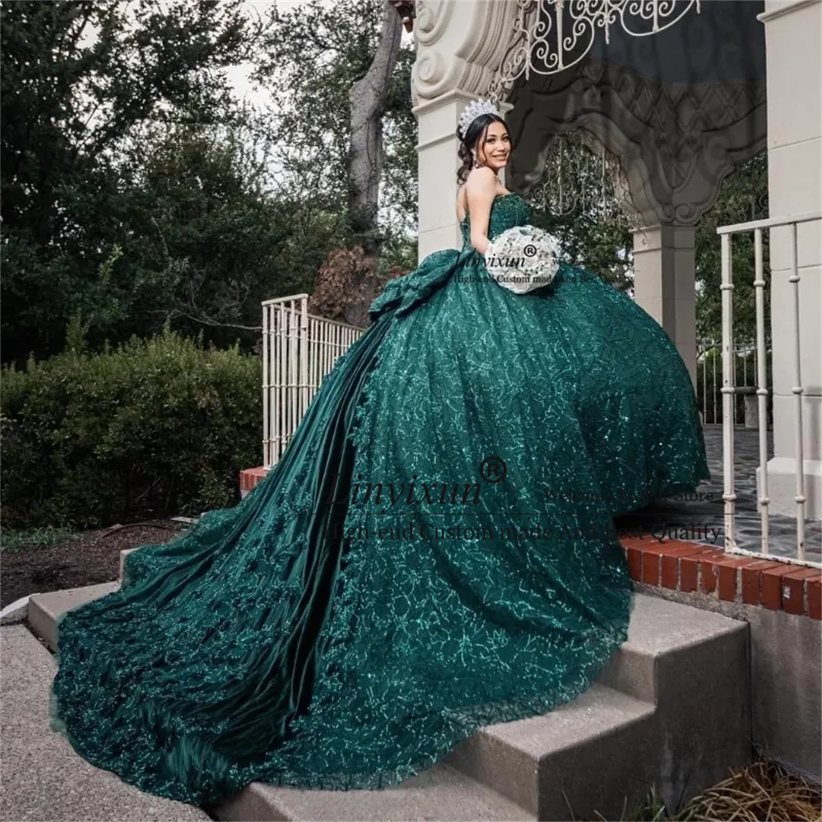 Emerald Enchantment: Luxury Green Lace Ball Gown with Bow and Beaded Appliques